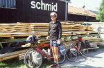 Jim-Schmid-in-front-of-Schmid-sign-in-Germany-AYH-Europe-Bicycle-Tour-1990